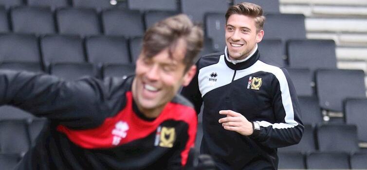 Willmott (right) started his career as an intern with MK Dons